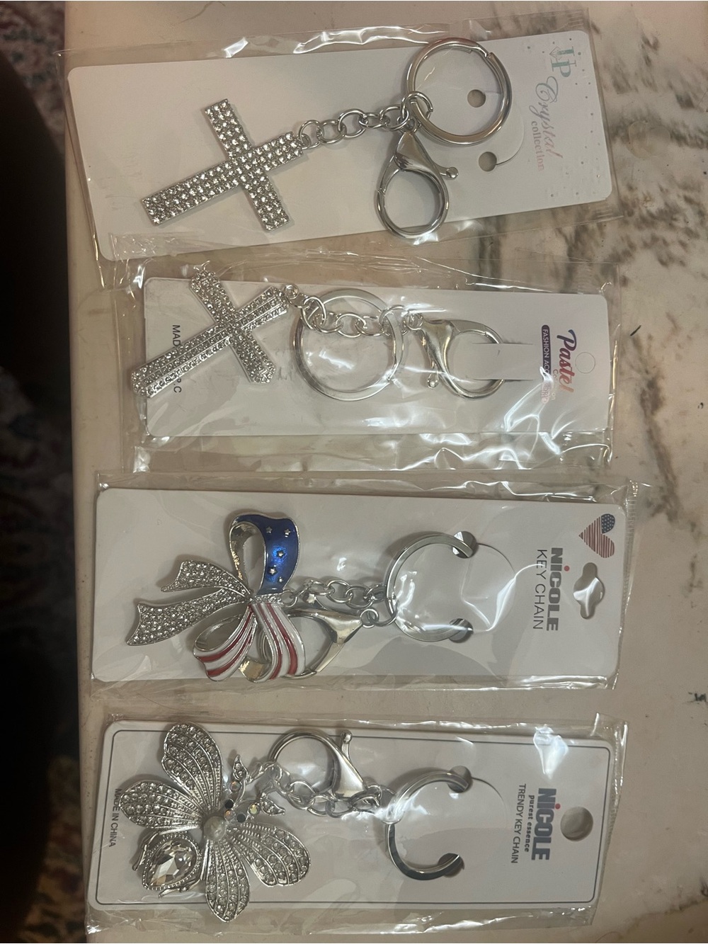 Four sparkly silver tone key chains - Picture 1 of 5